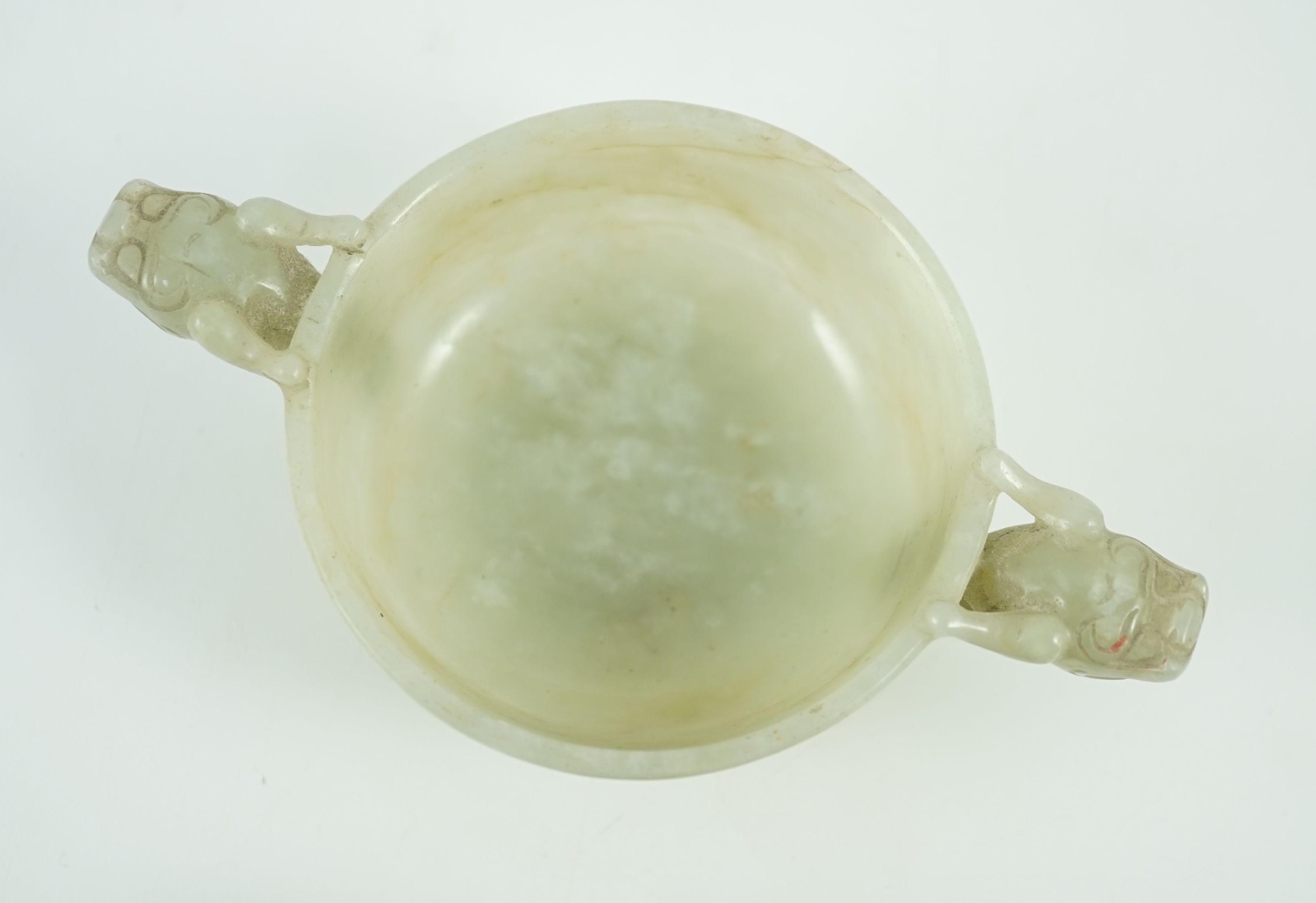 A Chinese pale celadon jade two handled ‘chilong’ cup, 17th/18th century, 13.2cm wide